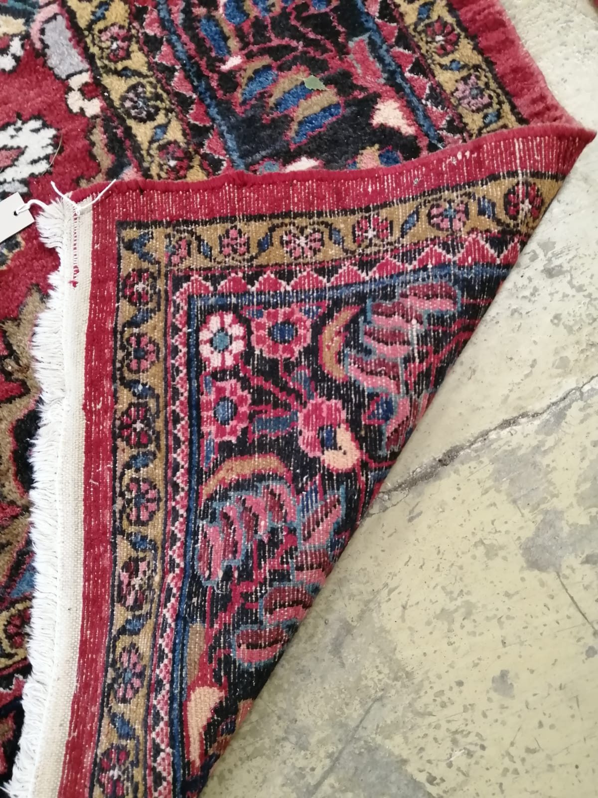 A Tabriz red ground carpet, 345cm x 241cm